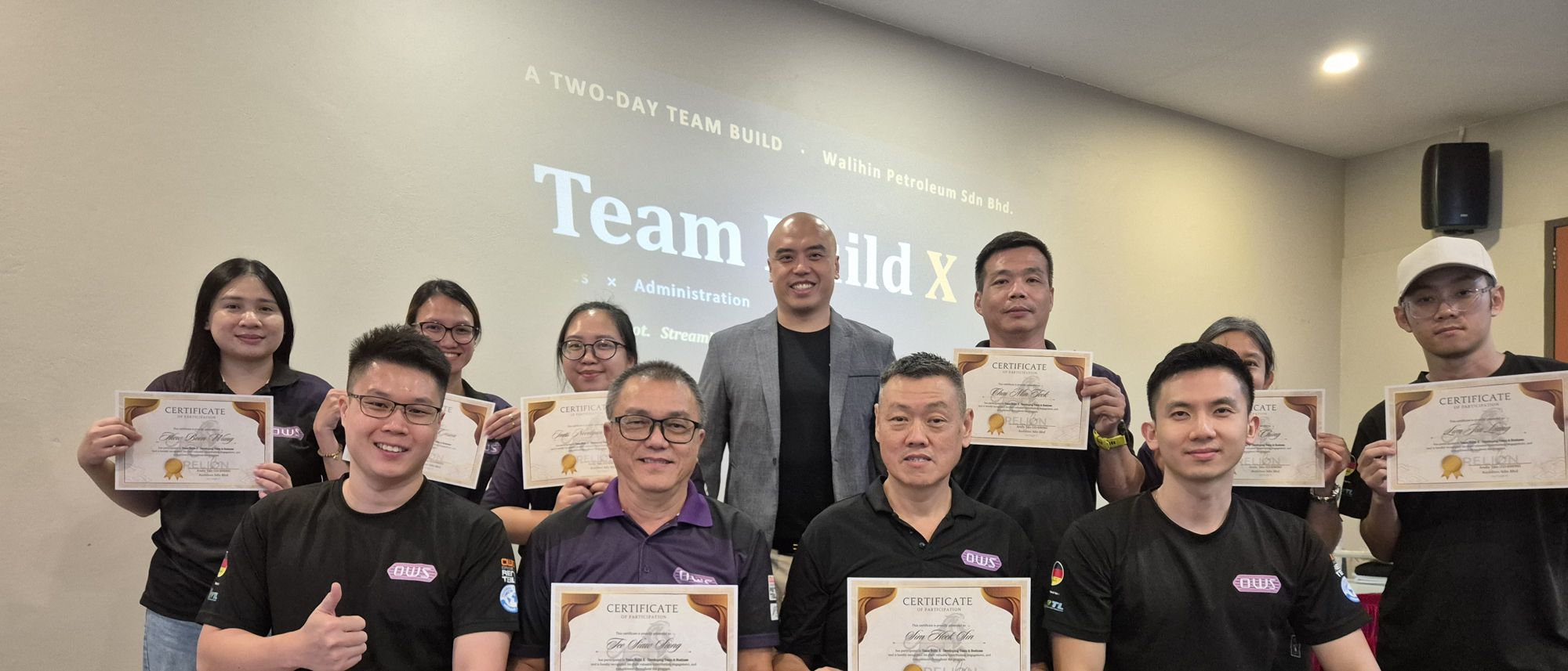 The Walihin Petroleum team at their two-day Team Build X, holding certificates