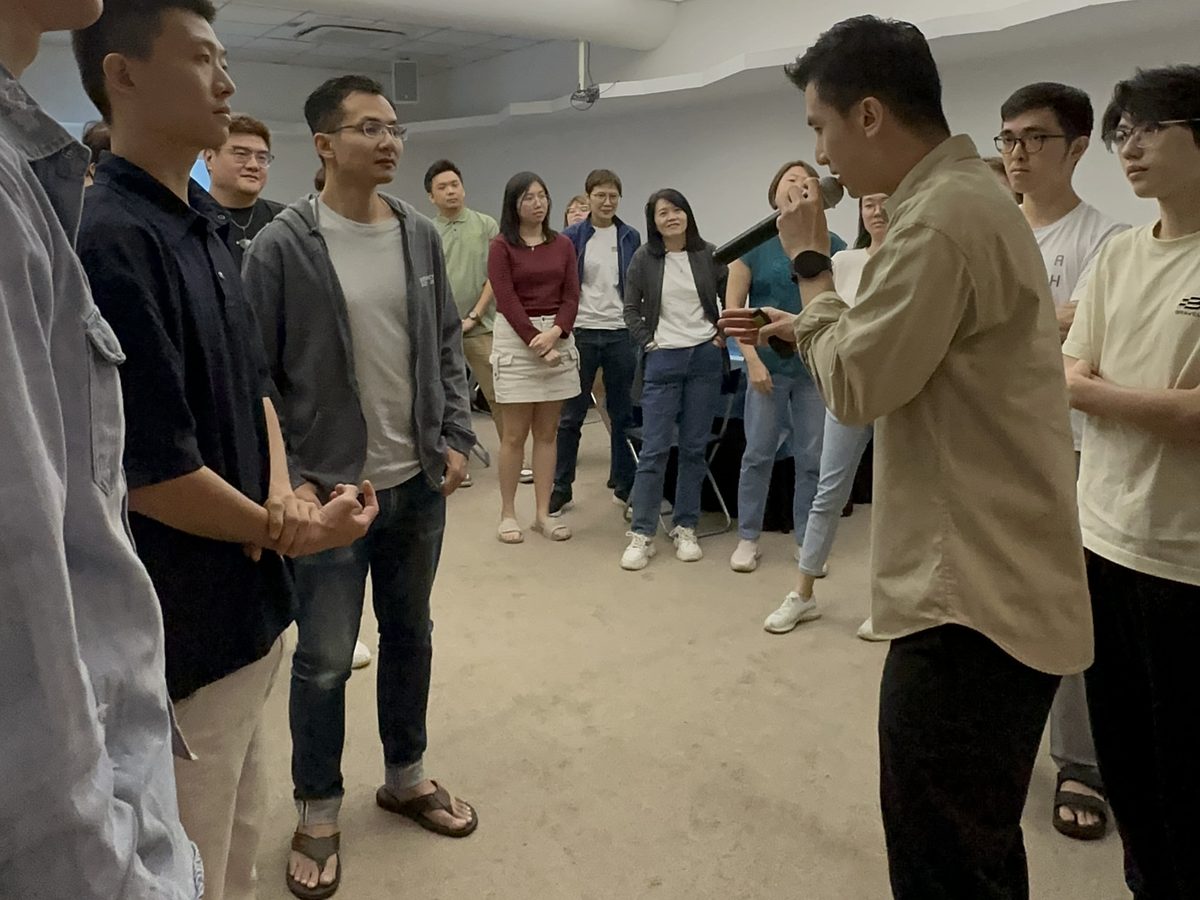 Participants standing in a circle during an activity