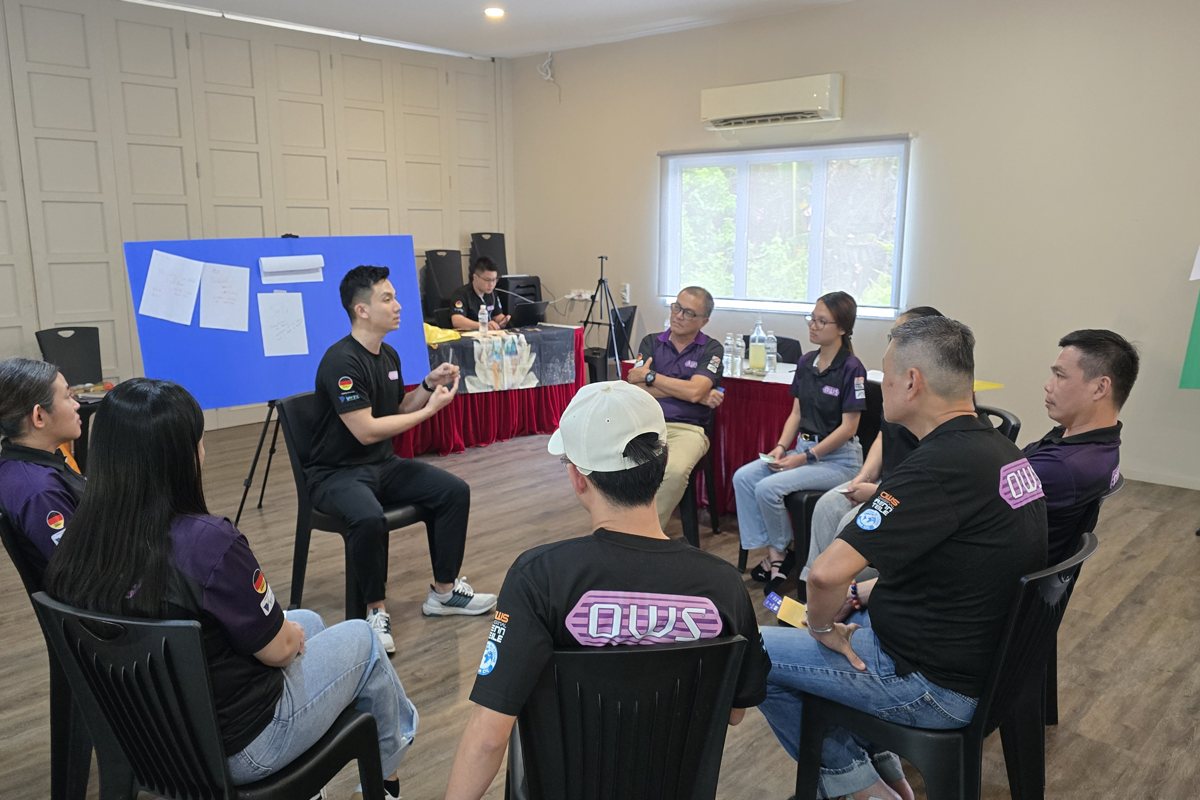 Participants building a hands-on team challenge