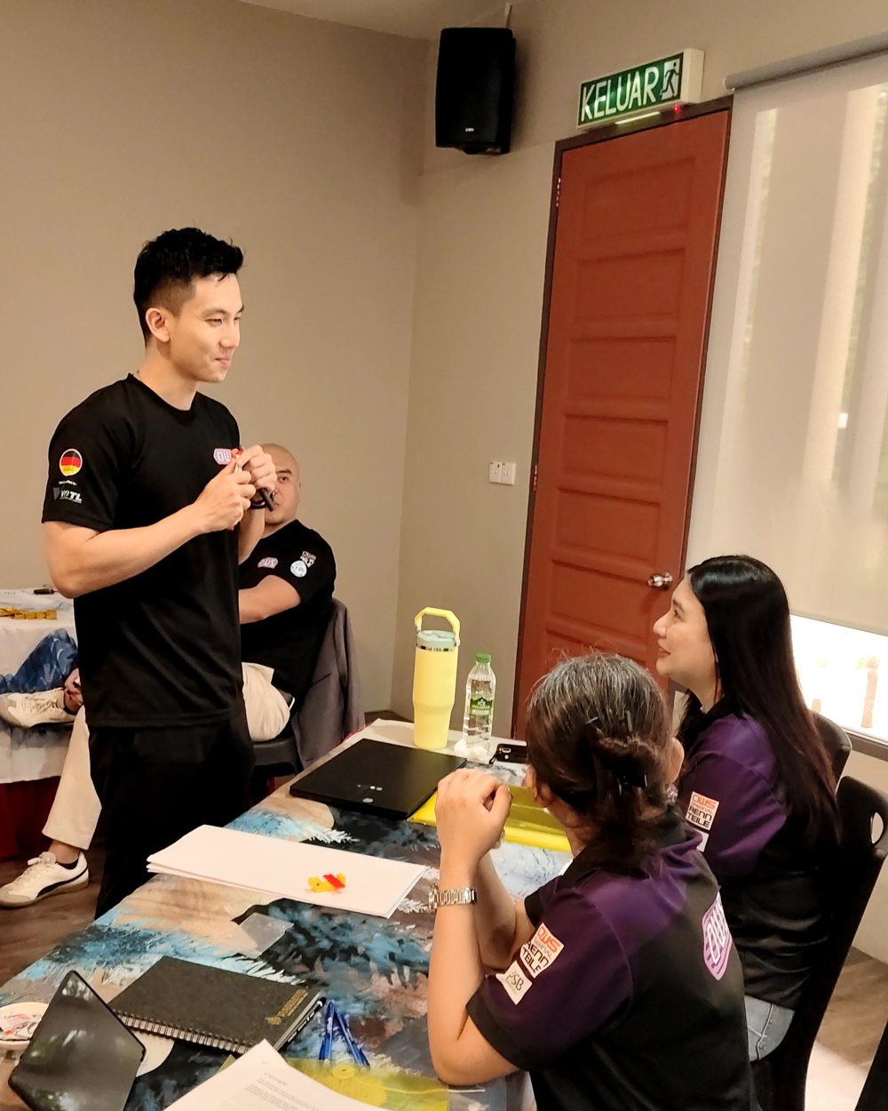 A trainer coaching participants during a session
